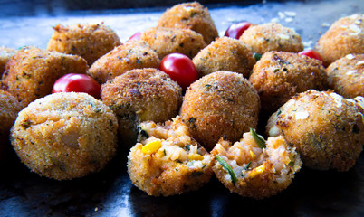 Deep Fried Risotto Balls with cherry tomatoes and basil