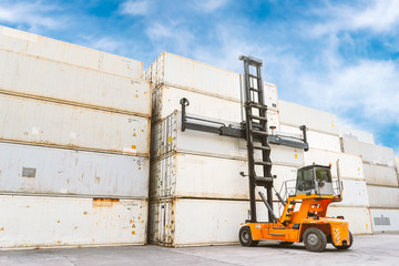A forklift along with many containers in the courtyard. Transport & Industry Concept.