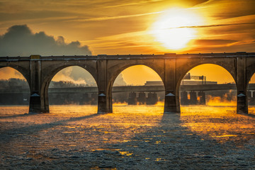 A blazing sunrise over a railroad bridge in Harrisburg, Pennsylvania