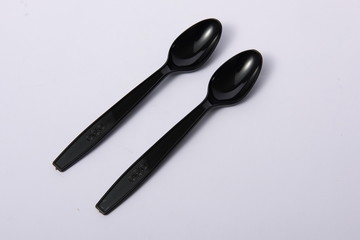 A disposable fork spoon. Quick and comfortable to use at parties. Recycle tableware. Plastic processing problems