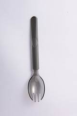 A disposable fork spoon. Quick and comfortable to use at parties. Recycle tableware. Plastic processing problems
