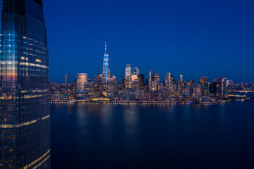 Fototapeta na wymiar Aerial view of New York city Manhattan skyline from Jersey at dusk.