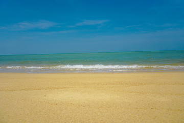 Fototapeta na wymiar Golden sand beach has sand, sea water, sand, the sea water on the sand.