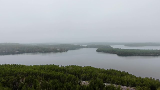 Aerial view of foggy horizon, lake and small islands with dense forest (Willard Lake, Ontario, Canada)