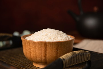 Rich and full rice in wooden bowl, retro style
