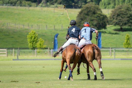 Polo scrum between two players on the field