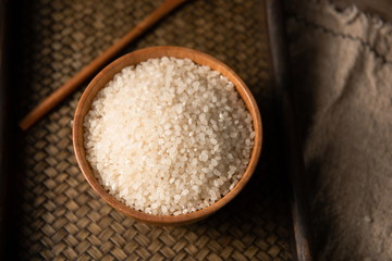 Rich and full rice in wooden bowl, retro style