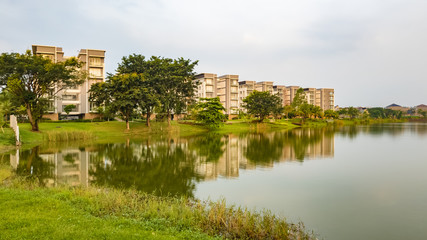 Fototapeta na wymiar Tangerang, Indonesia - 7th June 2019: Rainbow Springs Condo Villa, a luxury apartment complex, next to a lake, in Gading Serpong residential area. It is an area with high property development.