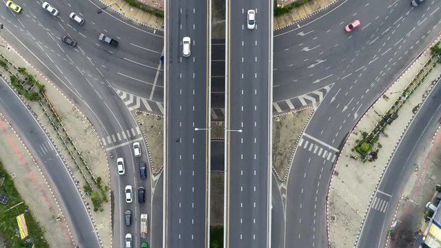 Time lapse aerial view above of circus road traffic cars in bangkok thailand.