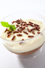 Vanilla and Chocolate Cream Mousse in Restaurant Glass Isolated