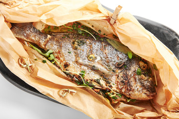 Baked dorado fish in parchment