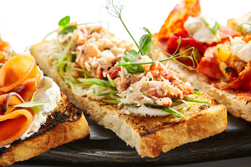 Bruschetta with crab and cucumber closeup view