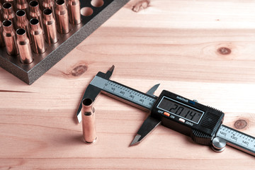 Production of cartridges for a rifle, reload. Measurement of the empty cartridges with a caliper