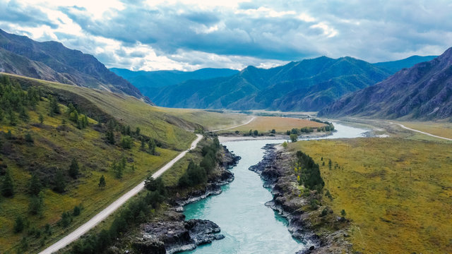 Mountain turquoise river, rocky banks aerial view. Drone shooting. Katun River, Altai.