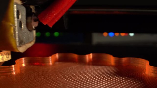 3d printing printer red model close-up. Automatic 3D printer