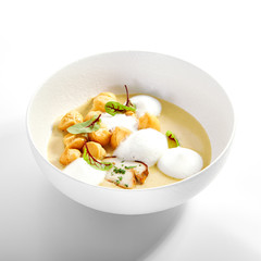 Wild mushroom cream soup with cheese profiteroles