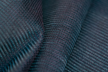 Shade net with detailed texture. Used in gardening, nursery, agriculture. Texture, weave pattern details close up. 
