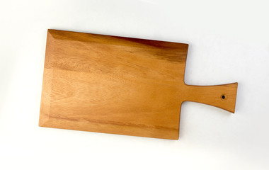 Top view of wooden cutting board isolated on a white background