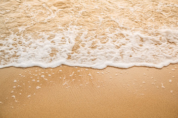 Fototapeta na wymiar Ocean wave on sandy beach