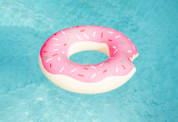 Inflatable swimming ring floating in pool