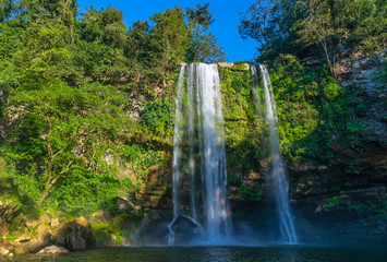 The waterfall of Misol Ha at sunset with spray in the air near Palenque, Chiapas state, Mexico.