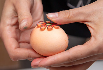 Decorating eggs in the kitchen.