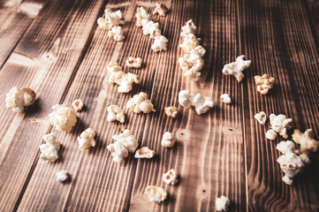 Popcorn flakes on a wooden background