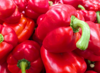 Ripe red paprika on a shelf in the store