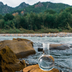 Glass flask with clean drinking water.
