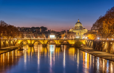 Fototapeta na wymiar The Tiber river and St. Peters Basilica in the Vatican City, Italy, at twilight