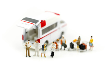 Naklejka premium Miniature people : Doctor team with Ambulance, coronavirus covid 19 infected patient caution outbreak alert.