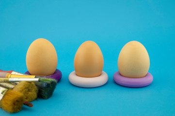 Easter eggs coloring concept on blue background