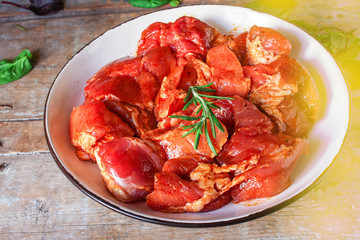 raw meat pork or beef in a plate on the table (preparing healthy food, marinade and spices paprika) menu concept background. top view. copy space for text