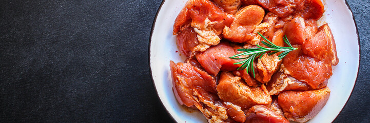 raw meat pork or beef in a plate on the table (preparing healthy food, marinade and spices paprika) menu concept background. top view. copy space for text