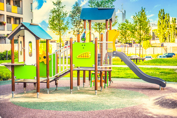  Modern playground on yard in the park near block of flats. Child concept.