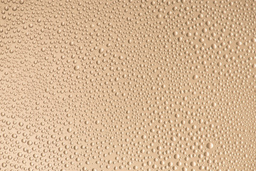 Fototapety  Close up photo of little water drops with contour shadow isolated on beige color background