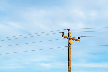 Electric pole against a blue sky
