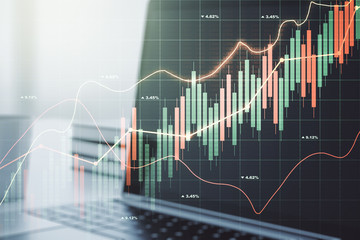 Double exposure of abstract creative financial chart on modern laptop background, research and strategy concept