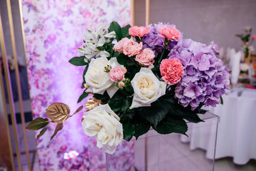  bright composition of flowers with violet and white elements on a light background