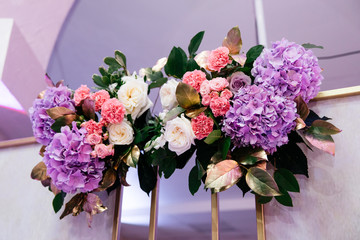  bright composition of flowers with violet and white elements on a light background