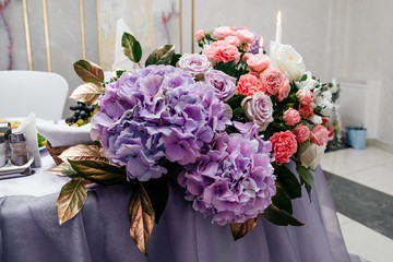  bright composition of flowers with purple elements on a light background