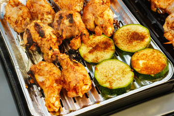 Chicken meat grilling on gas grill