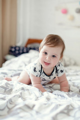 Cute caucasian baby in a white cloth