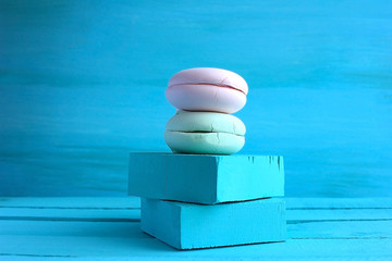 French macarons cake multi-colored  on a background of sky blue aqua