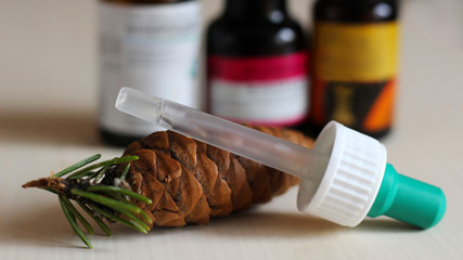 Medicine and pine cones, plant extract. Pipette.