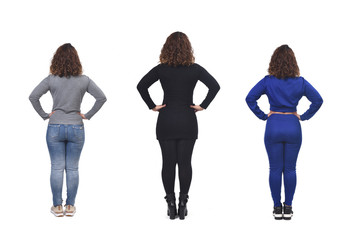 the same woman with casual elegant clothes and sportswear, hands on hip rear view