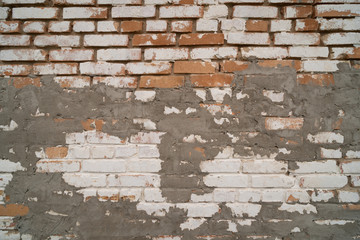 Old repaired weathered brick wall for background. 