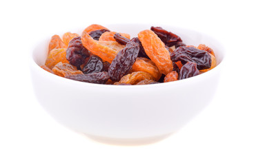 Dried raisins on white background