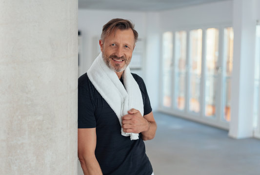 Fit healthy man with towel draped around neck