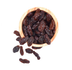 Top view Dried raisins in wooden cup on white background.